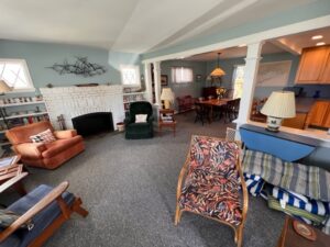 A living room with many chairs and tables