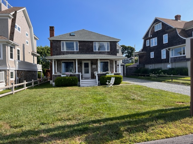 A house with a lot of grass in front of it