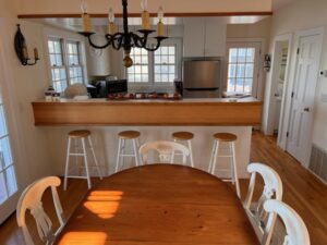 A dining room table with chairs around it