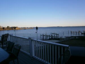 A view of the water from a deck.