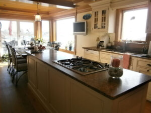 A kitchen with a stove and counter top