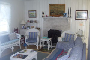 A living room with furniture and a fireplace.