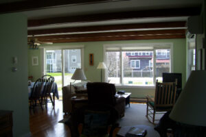 A living room with chairs and tables in it