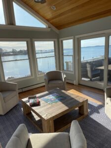 A living room with chairs and tables in it