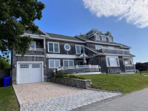 A large house with a driveway and garage.