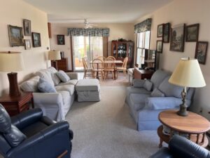 A living room with couches and chairs in it