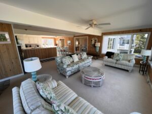 A living room with couches and tables in it