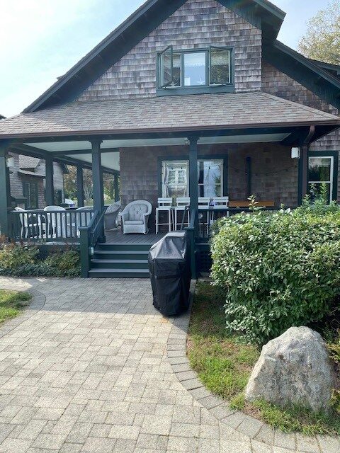 A house with a porch and patio area.