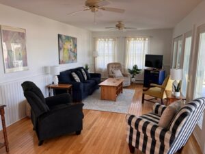 A living room with two couches, a tv and a table.