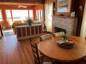 A living room with wood floors and furniture.