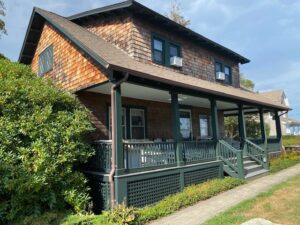 A house with a porch and a walkway.